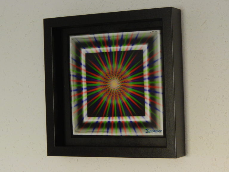 Ein Foto von einem psychodelischen Mandala in einem Objektrahmen